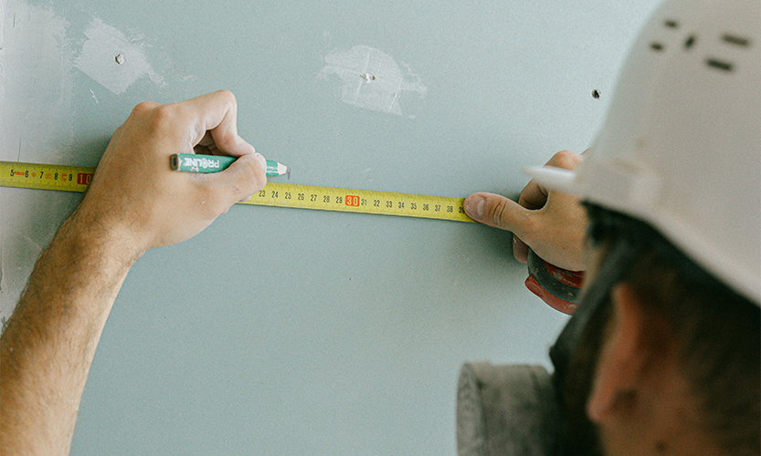 Measure and mark on the wall
